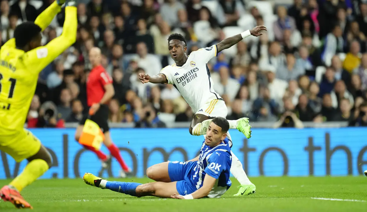 Dua dari lima gol kemenangan Real Madrid diborong oleh Vinicius. (AP Photo/Jose Breton)