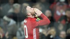 Manchester United meraih kemenangan 4-0 atas Feyenoord pada matchday kelima Grup A Liga Europa 2016-2017, di Stadion Old Trafford, Jumat (25/11/2016) dini hari WIB. Wayne Rooney mencetak gol pertama MU. (AFP/Oli Scarff)