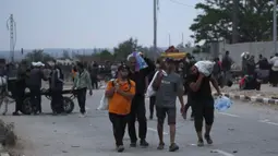 Sebelumnya, pada Sabtu (7/6/2025), pemerintah di Jalur Gaza menyatakan kesiapan penuh untuk mengamankan konvoi bantuan kemanusiaan. (Eyad BABA/AFP)