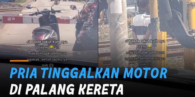 VIDEO: Demi Berteduh, Pria Tinggalkan Motor di Palang Kereta