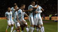 Selebrasi Lionel Messi setelah mencetak gol untuk timnas Argengtina ke gawang Uruguay, Jumat (2/9/2016). (AFP)
