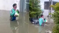 Meski Sedang Banjir Driver Ojol Ini Tetap Semangat Antar Pesanan, Bikin Salut. (Sumber: Instagram/gojek24jam)
