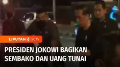 Ratusan warga antusias untuk mendapatkan paket sembako dan uang yang dibagikan Presiden Joko Widodo di Kota Bogor, Jawa Barat, Kamis (14/4) malam. Presiden juga sempat membagikan secara langsung bantuan untuk warga ini.