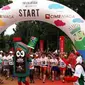 Para peserta Happiest 5K tak hanya semangat berlari, mereka juga antusias mengejar Maskot Castrol MAGNATEC STOP-START untuk berfoto selfie.