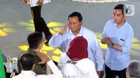 Pasangan Capres dan Cawapres nomor urut 2, Prabowo Subianto-Gibran Rakabuming Raka saat tiba dalam acara Paku Integritas penguatan antikorupsi untuk calon presiden dan wakil presiden 2024 di Gedung Merah Putih, Jakarta, Rabu (17/12204). (Liputan6.com/Angga Yuniar)