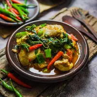 ilustrasi ayam woku/Aris Setya/Shutterstock