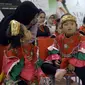 Siswa dari sekolah tari difabel Belantara Budaya Indonesia saat acara peluncuran sekolah tari tradisional gratis difabel di Margo City, Depok, Jawa Barat, Sabtu (3/12/2022). Acara yang juga sekaligus memperingati Hari Disabilitas Internasional ini menampilkan tarian tradisonal Indonesia di mana sebagian besar penarinya adalah penyandang disabilitas. (Liputan6.com/Johan Tallo)