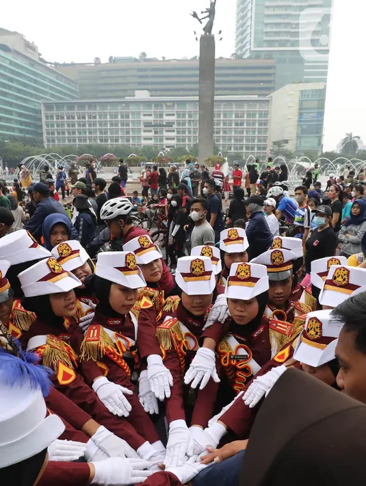 Polisi Cilik bersiap melakukan aksi baris-berbaris  saat CFD di kawasan Budaran HI, Jakarta, Minggu (3/7/2022). Aksi ini dalam rangka memeriahkan HUT ke-76 Bhayangkara. (Liputan6.com/Angga Yuniar)