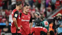 Bayer Leverkusen menyerah 2-3 dari RB Leipzig pada laga pekan kedua Bundesliga di&nbsp;BayArena, Leverkusen, Sabtu (31/8/2024) malam WIB. Bagi Leverkusen, itu adalah kekalahan perdana di Bundesliga setelah 463 hari. (AFP/UWE KRAFT)