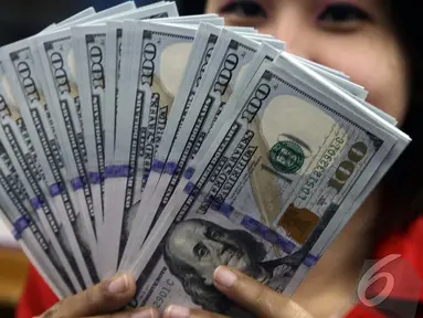 Nilai tukar rupiah terhadap dolar Amerika Serikat (AS) terus menguat, Jakarta, Kamis (23/10/2014) (Liputan6.com/Johan Tallo)