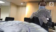 Nilai Tukar Rupiah Ditutup Melemah, Tertekan Sikap The Fed