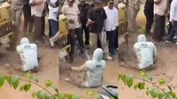 Tangkapan layar rekaman video anggota DPRD Lampung disiram air kebangun jalan rusak oleh warga di Lampung Tengah. Foto : (Istimewa).