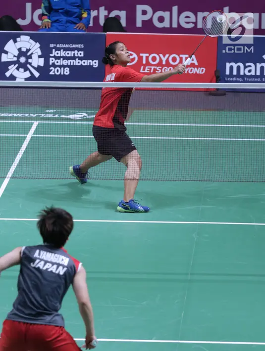 Tunggal putri Indonesia, Gregoria Mariska Tunjung saat melawan pemain Jepang, Akana Yamaguchi pada semifinal Bulutangkis Beregu Putri Asian Games 2018 di Jakarta, Selasa (21/8). (Liputan6.com/Helmi Fithriansyah)