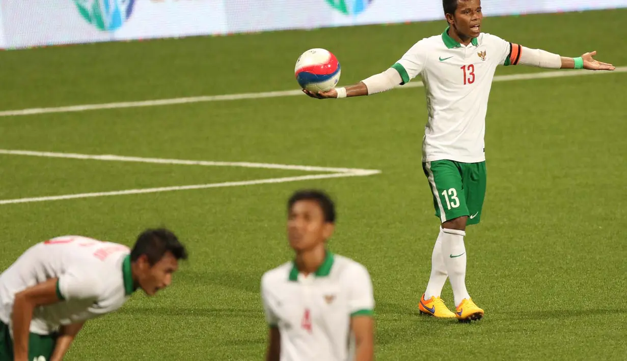 Manahati Lestusen saat membela Timnas Indonesia U-23 di ajang SEA Games 2015 Singapura (Bola.com/Arief Bagus)