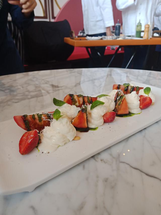 Strawberry salad, tomato, parmesan and basil