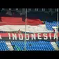 Suporter timnas U-19 Indonesia membentangkan bendera Merah Putih sebagai tanda dukungan saat pertandingan Grup B Piala Asia U-19 melawan timnas U-19 Australia di Stadion Thuwunna Youth Training Center Yangon, Myanmar, (12/10/2014). (ANTARA FOTO/Andika Wah