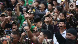 Sebelumnya, pada Kamis (12/3/2026), KPK secara resmi melakukan penahanan Yaqut Cholil Qoumas terkait dugaan tindak pidana korupsi terkait kuota haji untuk penyelenggaraan ibadah haji Indonesia tahun 2023-2024. Tampak dalam foto, anggota dan simpatisan Barisan Ansor Serbaguna (Banser) saat berunjuk rasa di depan gedung Merah Putih Komisi Pemberantasan Korupsi (KPK), Jakarta, Kamis (12/3/2026). (Liputan6.com/Helmi Fithriansyah)