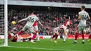 Takehiro Tomiyasu semakin menyempurnakan Arsenal dengan golnya pada menit ke-90+6. Arsenal pun menang 5-0 atas Sheffield United. (John Walton/PA via AP)