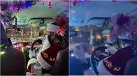 Driver taksi online pakai kostum Sinterklas dan mendekorasi mobilnya dengan lampu Natal. (sumber: 8days)