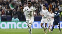 Vinicius Junior berhasil mencetak satu gol saat Real Madrid meraih kemenangan 3-0 atas Pachuca pada laga final Piala Interkontinental 2024 di Lusail Stadium, Lusail, Kamis (19/12/2024) dini hari WIB. Hasil itu membuat Madrid berhak atas trofi juara Piala Interkontinental 2024. (AFP/KARIM JAAFAR)