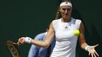 Kristina Mladenovic berusaha mengembalikan bola kearah lawannya Alison Riske pada hari keempat tunggal putri di Wimbledon Tennis Championships 2017, London , (6/7/2017). (AP/Alastair Grant)