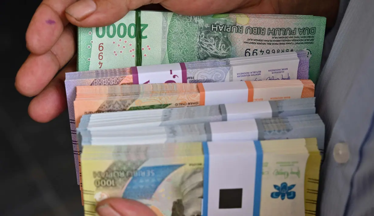Bank Indonesia juga membuka kuota 5 ribu pendaftar penukaran uang melalui aplikasi PINTAR. (Adek BERRY/AFP)