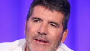 Simon Cowell merupakan sahabat dekat dari Cheryl Cole, tak hanya itu, Simon Cowell berpendapat bahwa Liam Payne adalah sosok pria pendamping yang cocok untuk Cheryl. (AFP/Bintang.com)