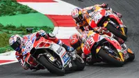 Persaingan yang terjadi antara Andrea Dovizioso, Marc Marquez, dan Dani Pedrosa pada MotoGP Austria 2017. (Jure Makovec / AFP)
