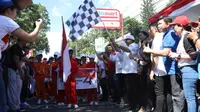 Menteri Pariwisata Arief Yahya melakukan flag off gerak jalan di Minahasa Utara.