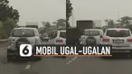 Aksi pengendara mobil ugal-ugalan saat dijalan membuat geram kendaraan lainnya karena hampir nyrempet mobil sampingnya.