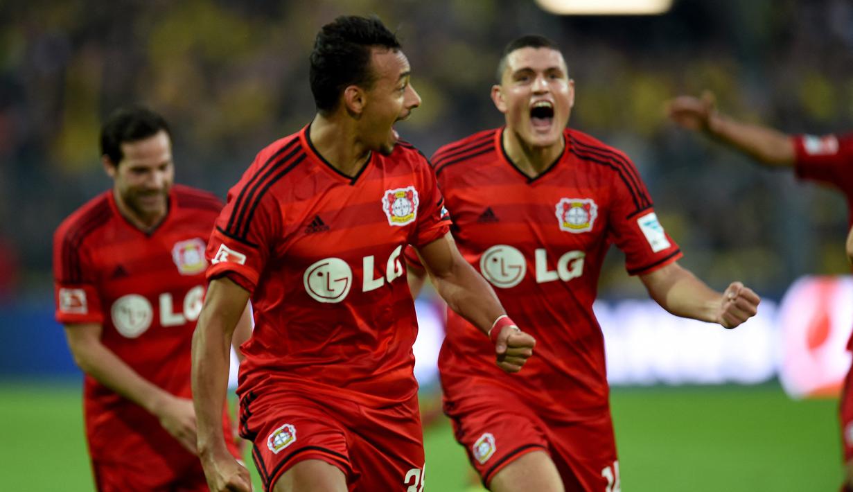 Karim Bellarabi. Sayap kanan Jerman berusia 32 tahun yang sejak awal musim 2011/2012 membela Bayer Leverkusen ini tercatat menjadi pencetak gol tercepat di Liga Jerman. Ia melakukannya saat laga Bayer Leverkusen menghadapi Borussia Dortmund berjalan 9 detik dalam pekan pertama Liga Jerman musim 2014/2015. Laga pun akhirnya dimenangkan Bayer Leverkusen dengan skor 2-0. (AFP/Patrik Stollarz)