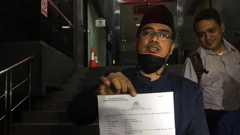 Ketua Umum Cyber Indonesia, Muannas Alaidid, di Polda Metro Jaya, Senin (3/8/2020) malam, untuk melaporkan Anji dan Hadi Pranoto