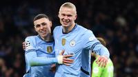Pemain Man City, Erling Haaland (kanan) mencetak dua gol ke gawang Feyenoord pada lanjutan Liga Champions 2024/2025 di Etihad Stadium, Rabu (27/11/2024) dini hari WIB. (Darren Staples / AFP)