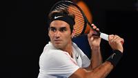 Roger Federer beraksi di final Australia Terbuka (AFP/ Saeed Khan)
