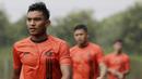 Pemain Persija Jakarta, Muhammad Rafli, saat latihan di Lapangan NYTC, Sawangan, Depok, Kamis (16/1/2020). Hujan deras beserta petir membuat latihan Persija Jakarta kali ini hanya berlangsung sekitar 25 menit. (Bola.com/M Iqbal Ichsan)