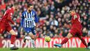 Gelandang Brighton, Davy Propper, berusaha melewati bek Liverpool, Dejan Lovren, pada laga Premier League di Stadion Anfield, Liverpool, Sabtu (1/12). Liverpool menang 2-1 atas Brighton. (AFP/Paul Ellis)