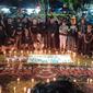 Ribuan suporter bola yang ada di Kota Bogor, Jawa Barat, menggelar doa bersama dengan menyalakan lilin solidaritas untuk Aremania dan Aremanita yang menjadi korban Tragedi Stadion Kanjuruhan, Malang, 1 Oktober 2022.