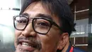 Tersangka Andi Zulkarnain Mallarangeng alias Choel Mallarangeng meninggalkan Gedung baru KPK, Jakarta, Jumat (24/2). Kedatangan Choel hanya untuk menandatangani perpanjangan masa tahanan selama 40 hari kedepan. (Liputan6.com/Helmi Afandi)