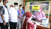 Simulasi pendistribusian vaksin Covid-19 di Kabupaten Kebumen, Rabu (13/1/2021). TNI-POLRI mengawal proses pengiriman hingg ke tempat penyimpanan di Puskesmas. (Foto: Liputan6.com/Polres Kebumen)