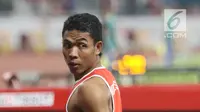 Pelari cepat Indonesia, Lalu Muhammad Zohri usai kualifikasi lari 100 meter Asian Games 2018 di Stadion GBK, Jakarta, Sabtu (25/8). Lalu M Zohri mencatat waktu 10,27 detik dan berhak tampil di semifinal. (Liputan6.com/Helmi Fithriansyah)