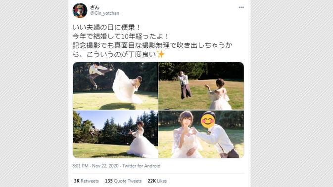 Sang cosplayer asal Jepang menjalani pemotretan di ulang tahun pernikahan dengan mengenakan gaun pengantin sambil berpose energik. (Tangkapan Layar Twitter @Gin_yotchan)