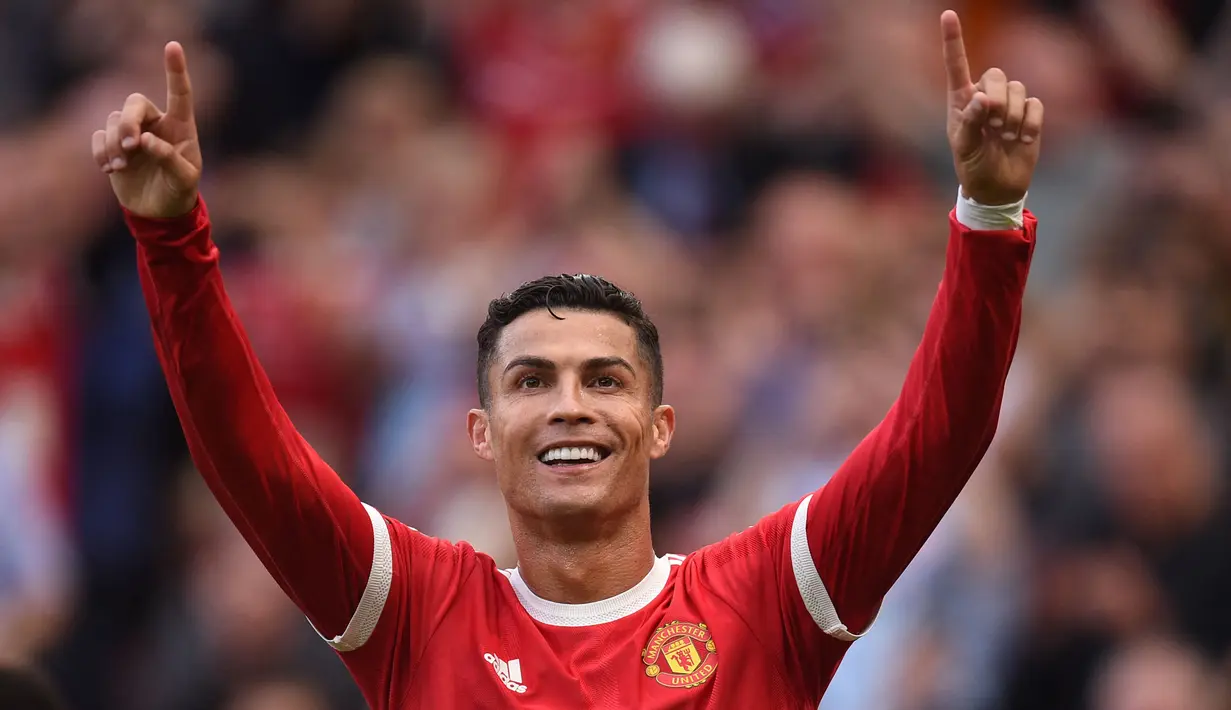 Cristiano Ronaldo langsung memberikan efek luar biasa untuk Manchester United. Tampil perdana pada momen comeback, ia langsung mencetak dua gol saat melibas Newcastle United 4-1. (Foto: AFP/Oli Scarff)
