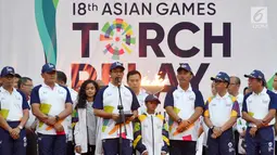 Gubernur DKI Jakarta, Anies Baswedan memberi sambutan usai Api Obor Asian Games 2018 tiba di Balai Kota, Jakarta, Rabu (15/8). (Liputan6.com/Fery Pradolo)