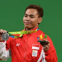 Indonesia meraih medali kedua di ajang Olimpiade Rio de Janeiro 2016 setelah lifter Eko Yuli Irawan menyabet medali perak di cabang angkat besi kelas 62 kg, Selasa (9/8/2016) pagi WIB. (AFP/Goh Chai Hin)