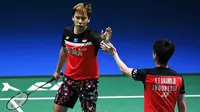 Ganda putra Kevin Sanjaya/Marcus Fernaldi Gideon saat bertanding melawan Hendra Setiawan / Mohammad Ahsan pada babak fina Jepang Terbuka 2019 di Tokyo (28/7/2019). Kevin / Marcus menang  21-19 dan 23-21.  (AFP Photo/Charly Triballeau)