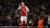 Declan Rice menjadi pahlawan kemenangan Arsenal saat menghajar Real Madrid 3-0 pada leg 1 perempat final Liga Champions 2024/2025 di Emirates Stadium, Rabu (9/4/2025) dini hari WIB. (Adrian Dennis / AFP)