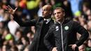 Gaya Pep Guardiola (kir) dan Brendan Rodgers saat memimpin anak asuhnya pada laga Grup C Liga Champion di Celtic Park stadium, Glasgow, Kamis (29/9/2016)dini hari WIB. (AFP/Oli Scarf)
