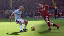 Aksi pemain Liverpool, Andrew Robertson (kanan) mengecoh pemain West Ham, Pablo Zabaleta pada laga Premier League pekan ke-28 di Anfield Stadium, Liverpool, (24/2/2018). Liverpool menang 4-1. (AFP/Oli Scarff)