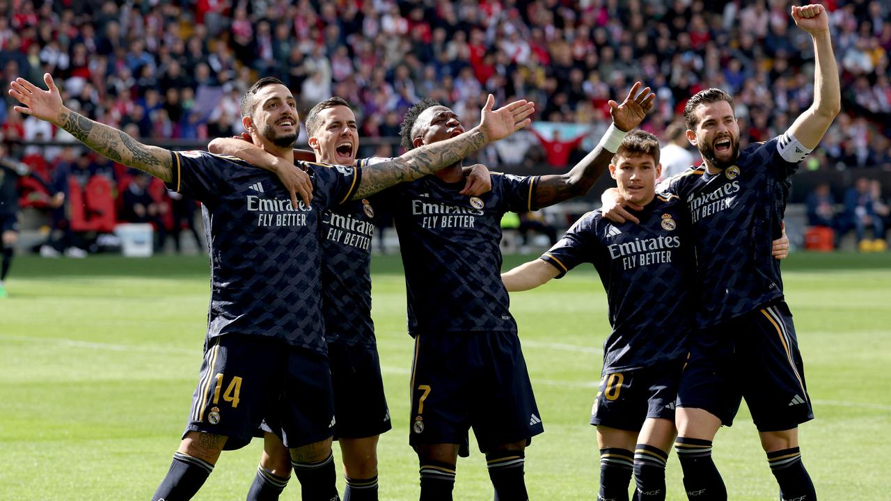 Penyerang Real Madrid, Joselu, ketika mencetak gol ke gawang Rayo Vallecano di La Liga 2023/2024.