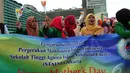 Sejumlah mahasiswa saat menggelar aksi memperingati Hari Ibu ke-86 di bundaran HI, Jakarta, Minggu (22/12/2014) (Liputan6.com/Johan Tallo)